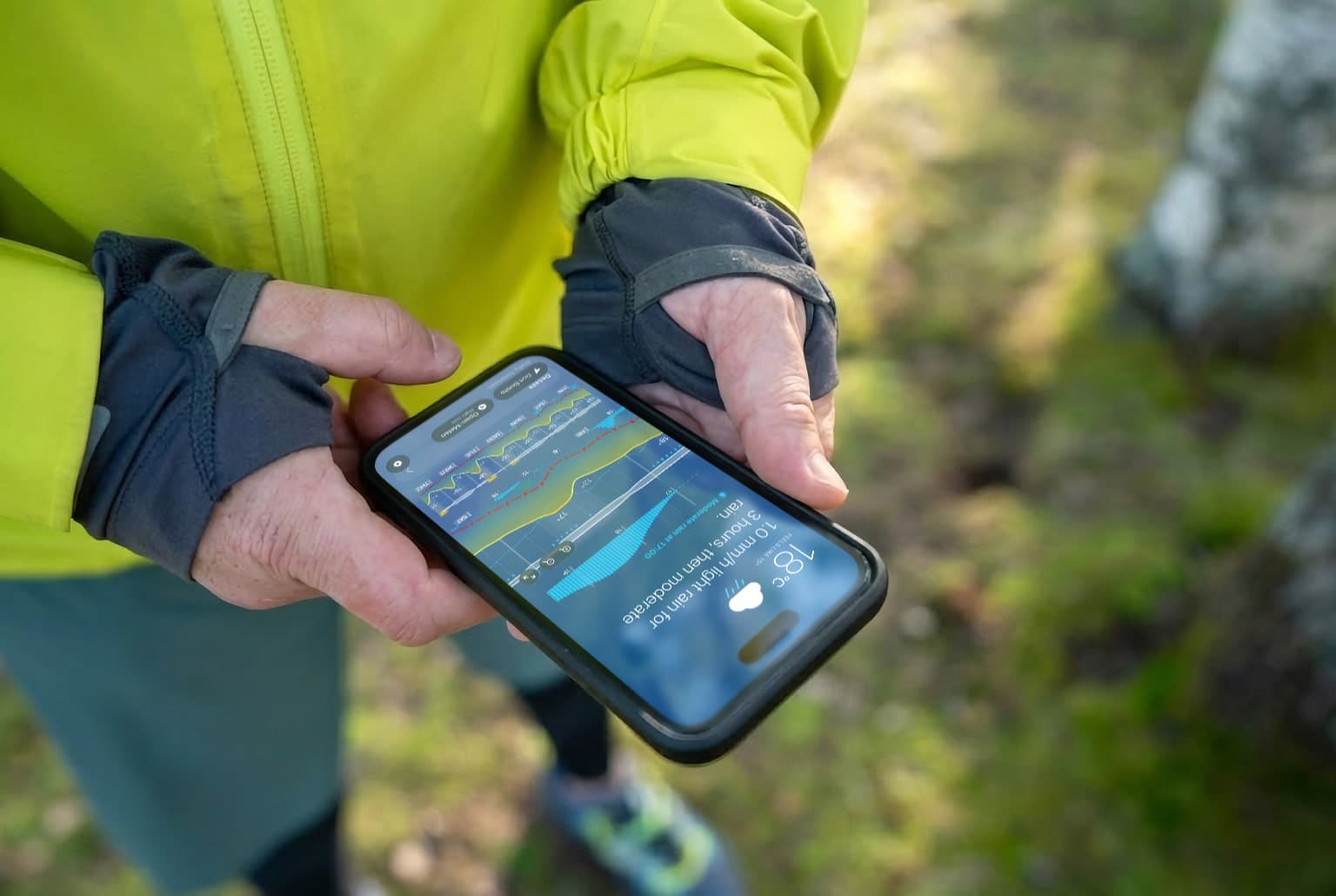 Runner checking Weathergraph on iPhone before heading out